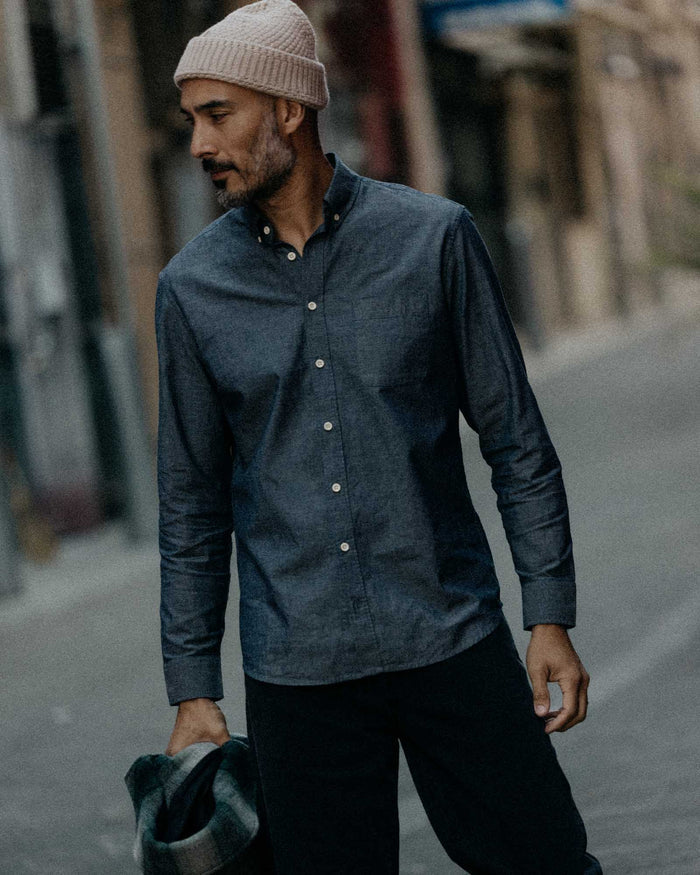 fit model looking out the window wearing The Jack in Rinsed Indigo Chambray