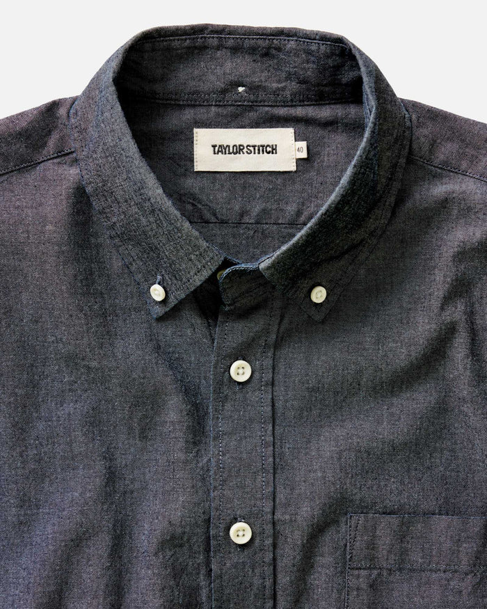 fit model sitting wearing The Jack in Rinsed Indigo Chambray