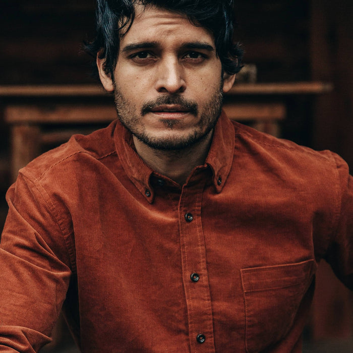 fit model wearing The Jack in Rust Cord, looking at camera