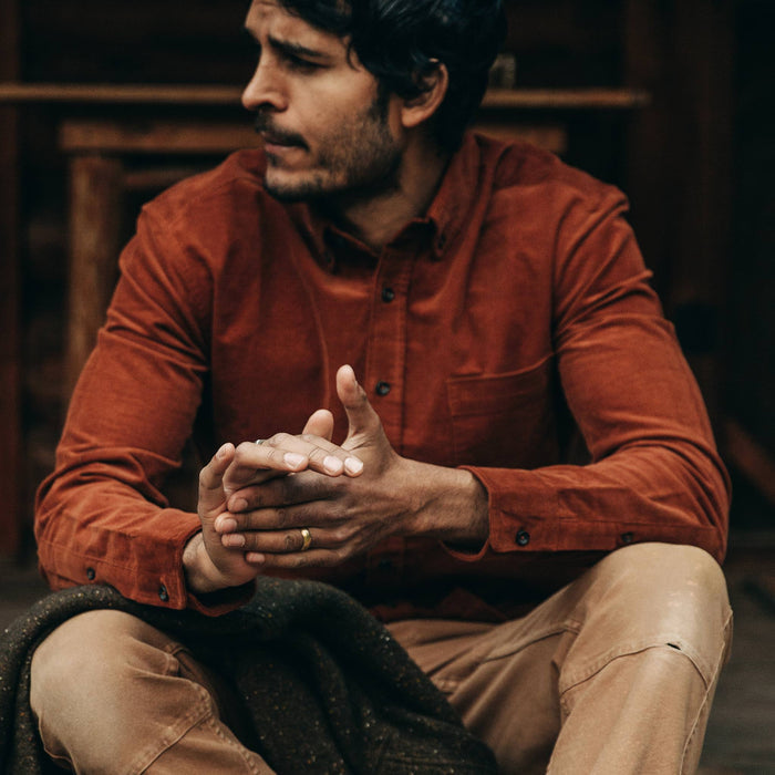 fit model wearing The Jack in Rust Cord, looking left