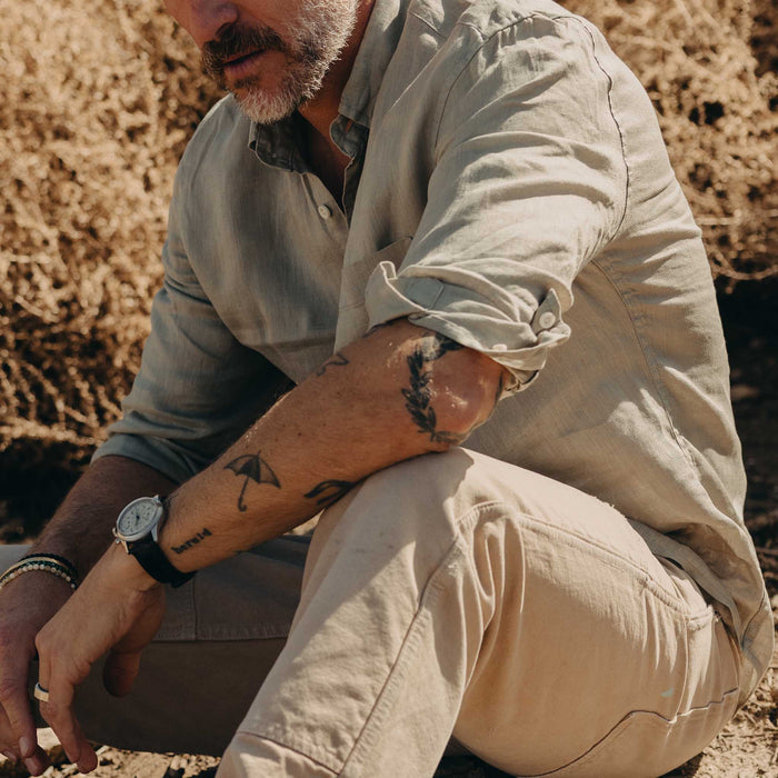 fit model sitting wearing The Jack in Seagrass Linen