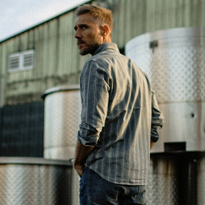 fit model looking over left shoulder The Jack in Sky Blue Chambray Stripe