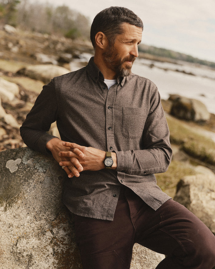 fit model sitting wearing The Jack in Timber Houndstooth