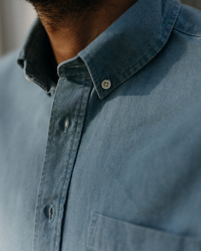 fit model showing off the buttons on The Jack in Washed Indigo Oxford