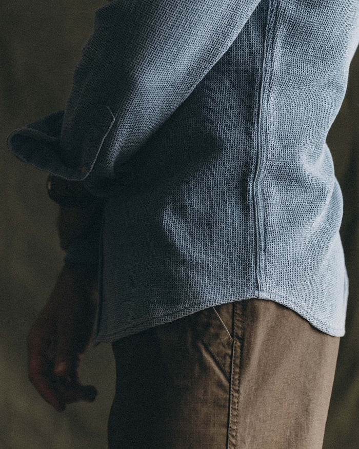 fit model standing on a rock wearing The Jack in Washed Indigo Waffle