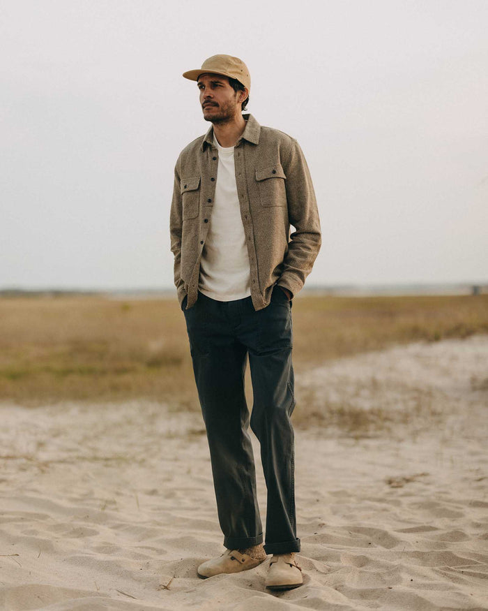 fit model standing wearing The Ledge Shirt in Army Linen Tweed