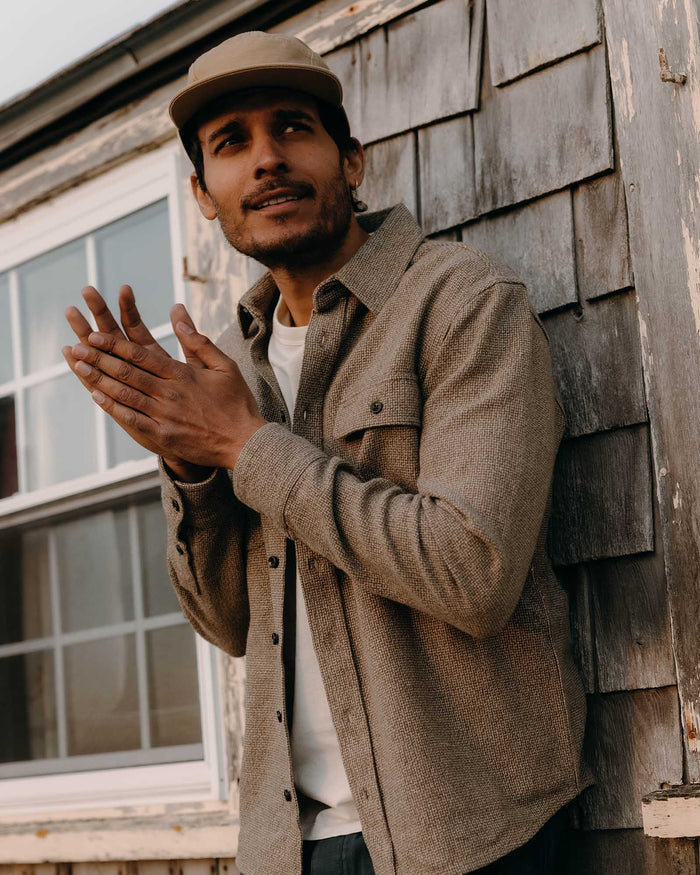 fit model posing in The Ledge Shirt in Army Linen Tweed