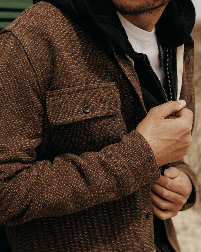 fit model showing off the pocket on The Ledge Shirt in Black Coffee Linen Tweed