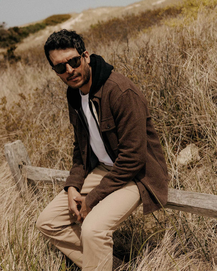 fit model sitting wearing The Ledge Shirt in Black Coffee Linen Tweed
