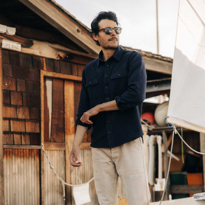 fit model posing in The Ledge Shirt in Dark Navy Linen Tweed