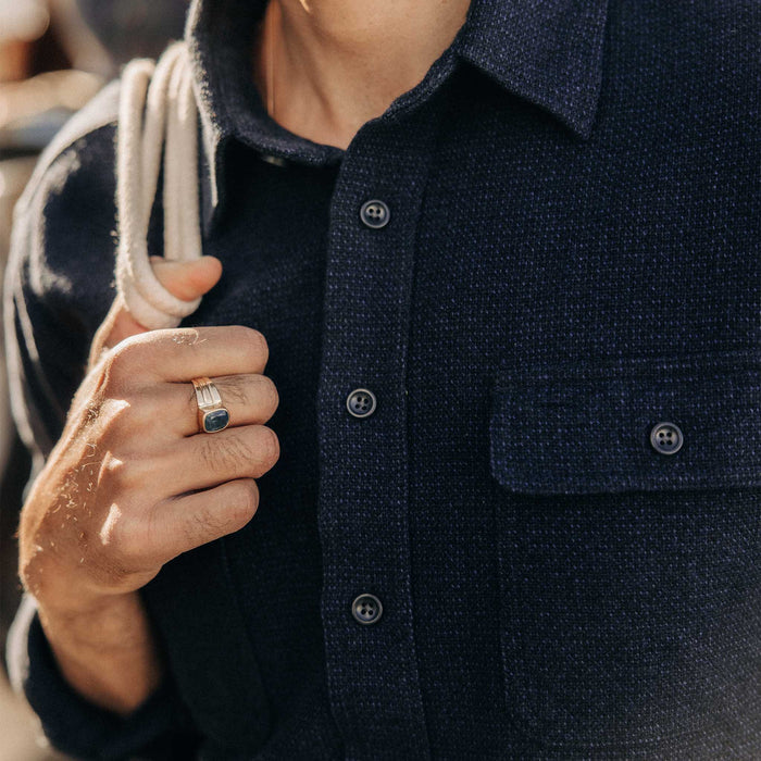 fit model showing off the buttons on The Ledge Shirt in Dark Navy Linen Tweed
