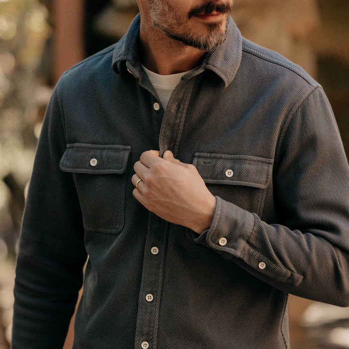 fit model adjusting buttons on The Ledge Shirt in Deep Sea Twill