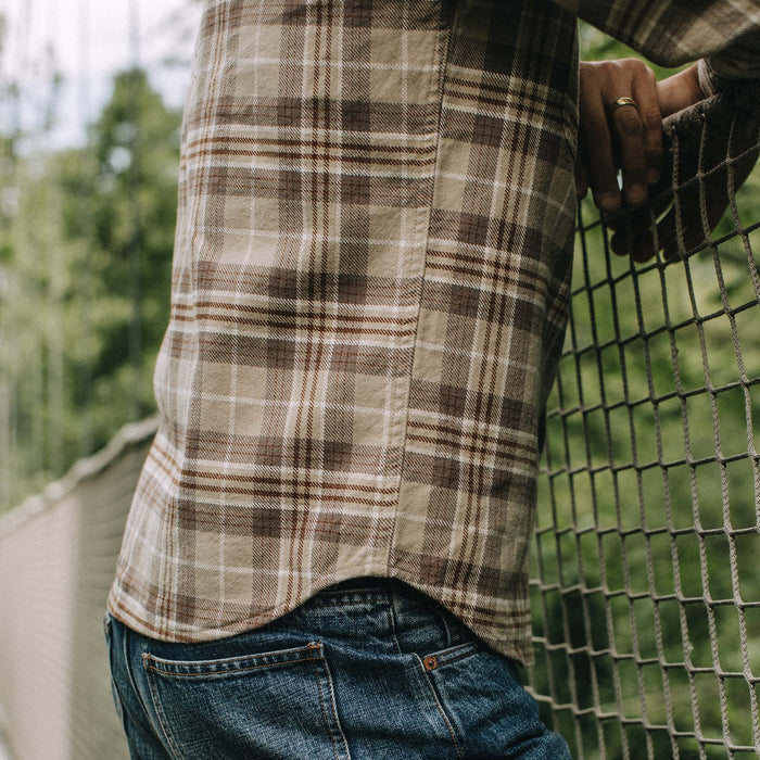 fit model showing off The Ledge Shirt in Fossil Plaid