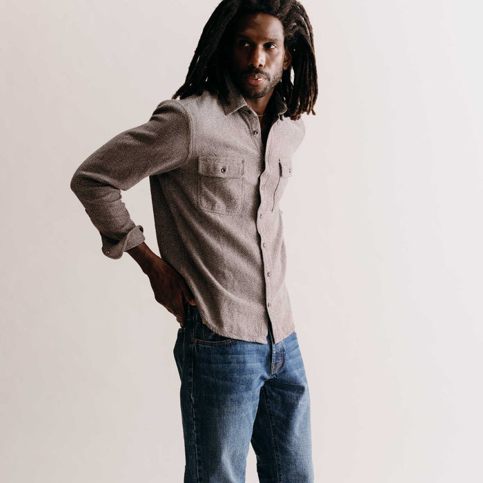 fit model adjusting sleeves of The Ledge Shirt in Granite Linen Tweed