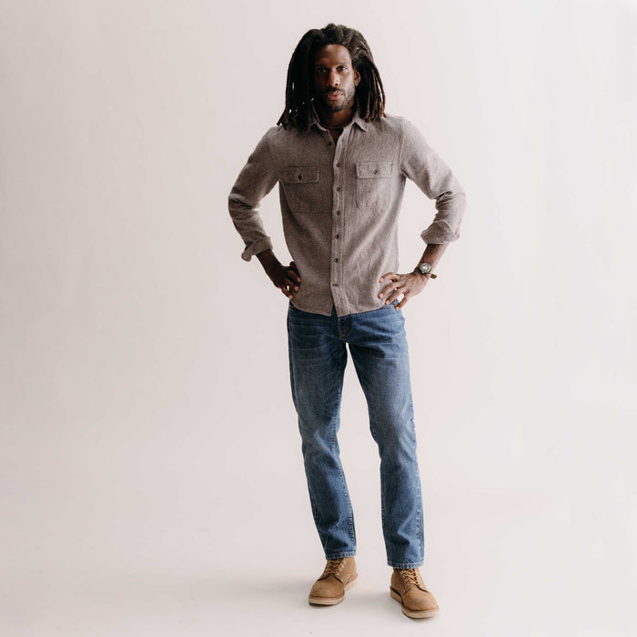 fit model with his hands on his hip wearing The Ledge Shirt in Granite Linen Tweed