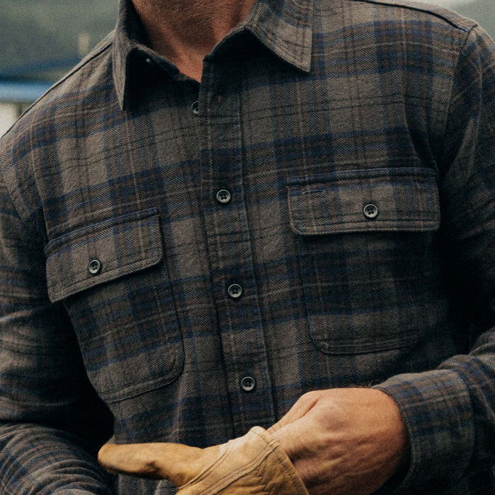 fit model showing off the pockets on The Ledge Shirt in Heather Granite Plaid