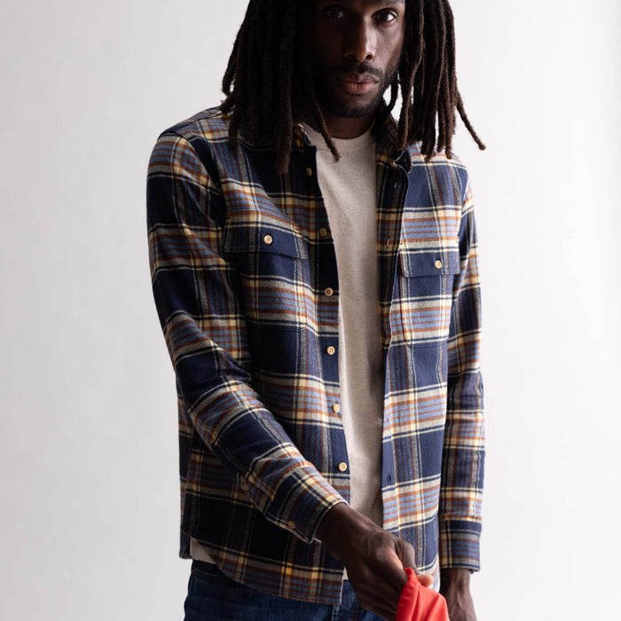 fit model posing in The Ledge Shirt in River Plaid