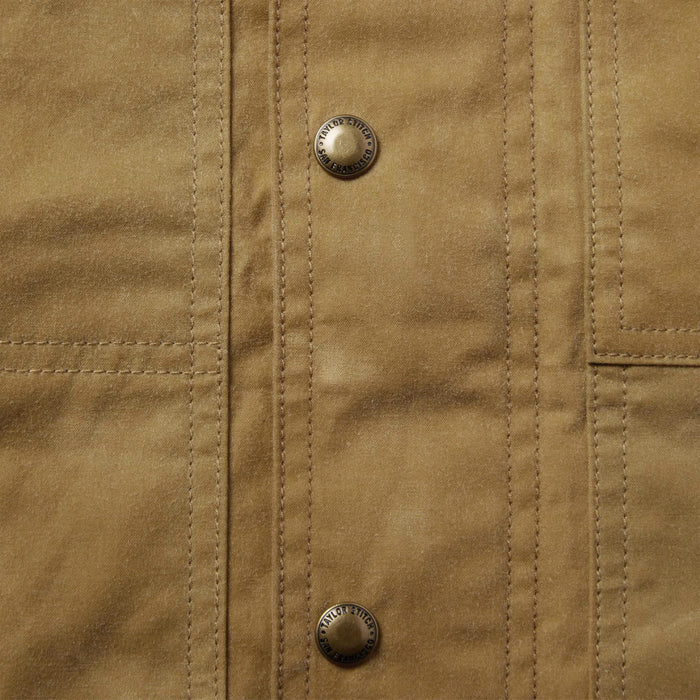 material shot of the buttons on The Lined Longshore Jacket in Harvest Tan Waxed Canvas