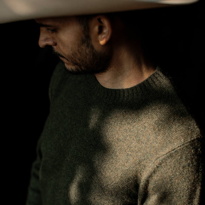 fit model wearing the lodge sweater, chest detail