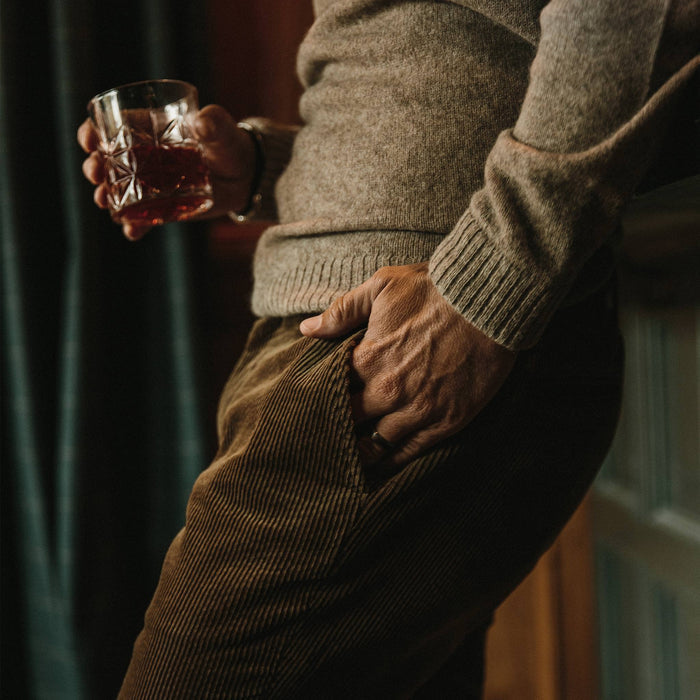 fit model wearing the lodge sweater, hand in pocket
