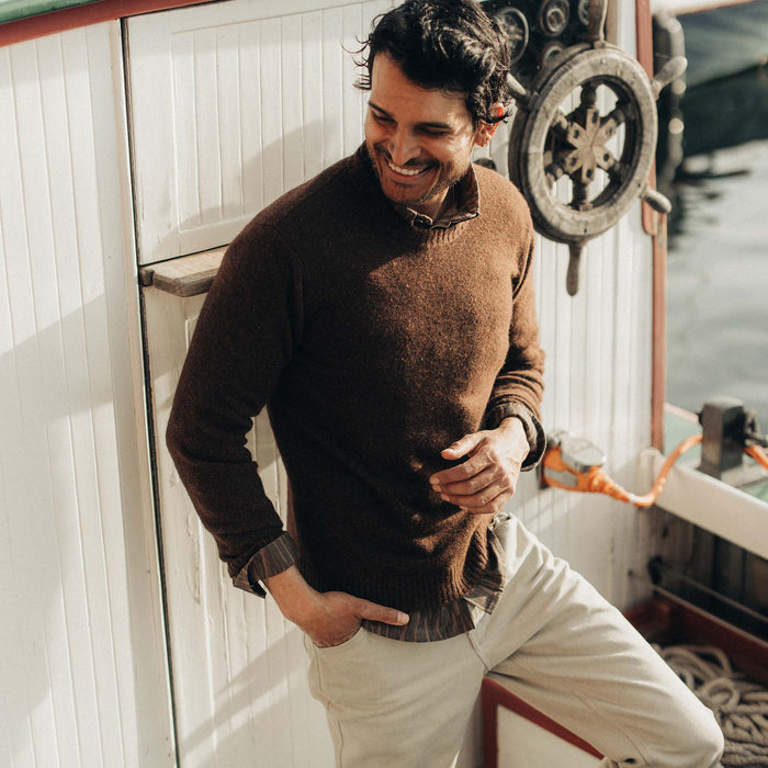 fit model posing in The Lodge Sweater in Timber Donegal
