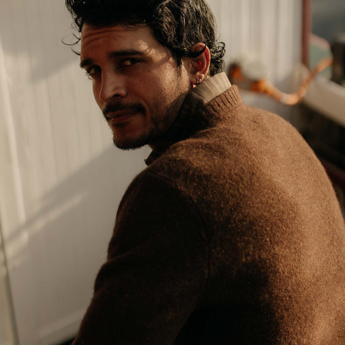 fit model showing off the back of The Lodge Sweater in Timber Donegal