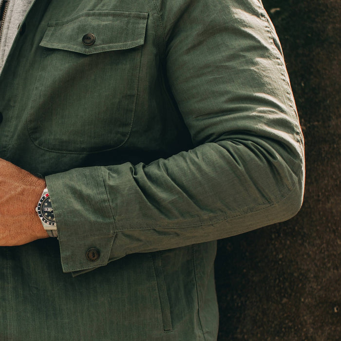 fit model wearing The Lombardi Jacket in Olive Dry Wax, sleeve