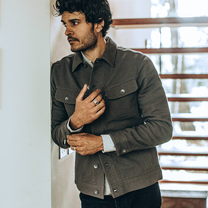 our fit model wearing The Long Haul Jacket in Ash Sashiko—looking left