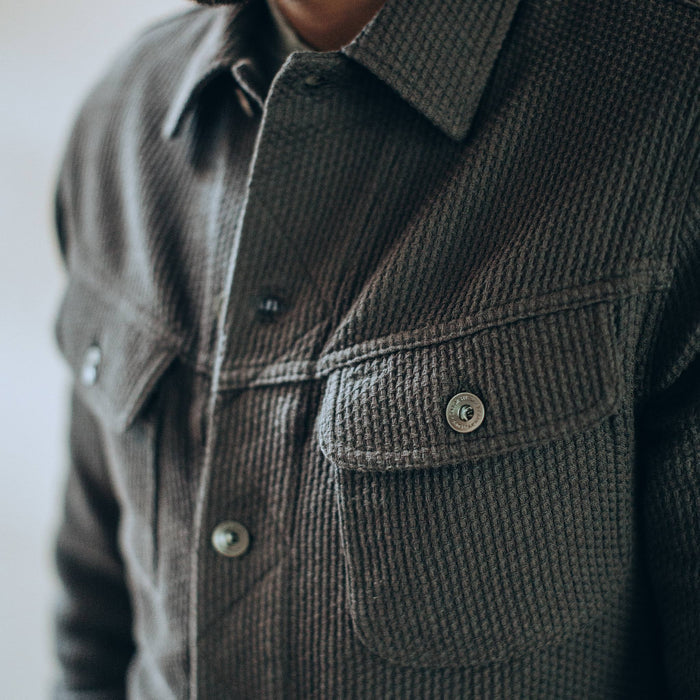 our fit model wearing The Long Haul Jacket in Ash Sashiko—cropped shot of buttoned chest