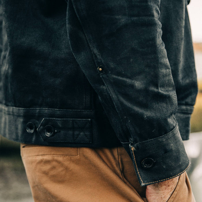 fit model wearing The Long Haul Jacket in Black Over-dye Selvage, sleeve shot