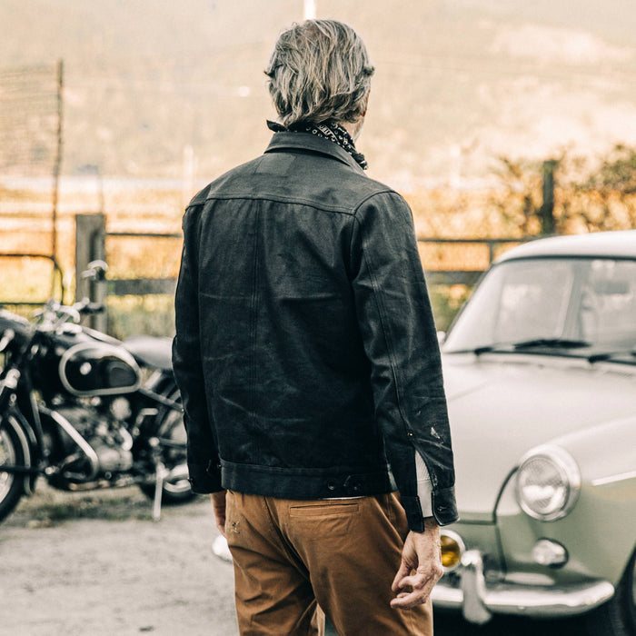 fit model wearing The Long Haul Jacket in Black Over-dye Selvage, back shot