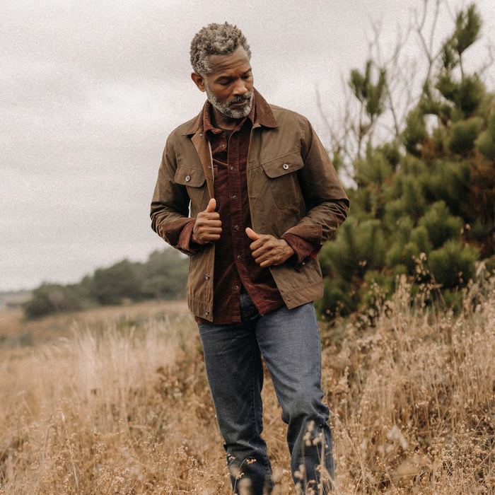 fit model wearing The Long Haul Waxed Canvas Jacket in Dark Khaki