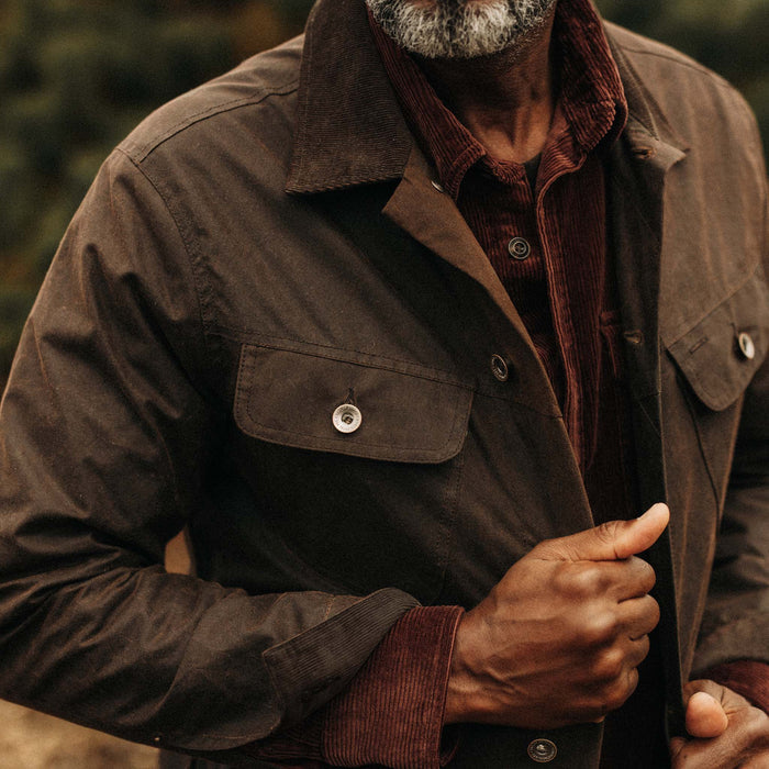 fit model showing off The Long Haul Jacket in Dark Khaki Waxed Canvas