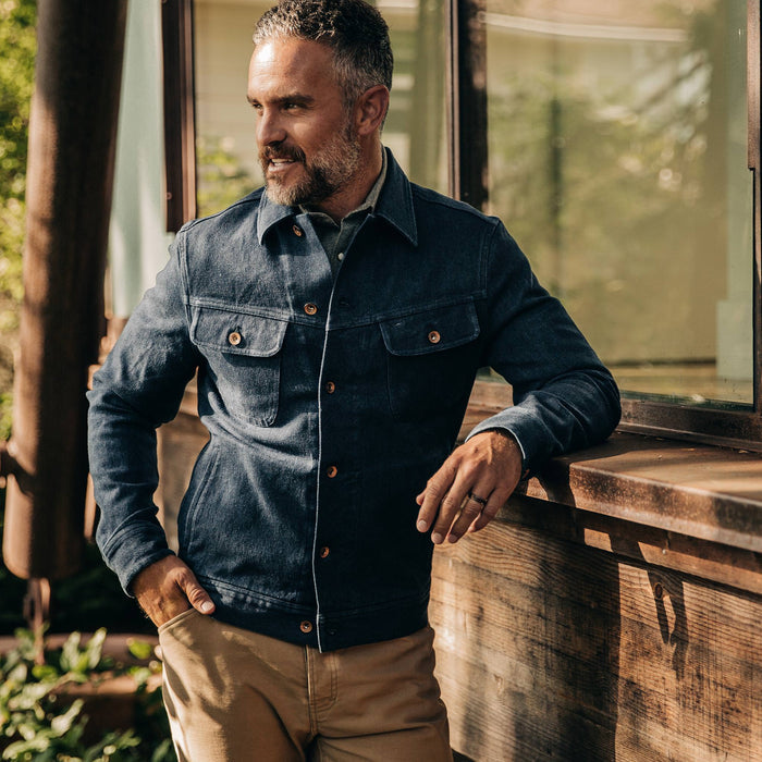 our fit model wearing The Long Haul Jacket in Indigo Boss Duck—cropped shot, looking left