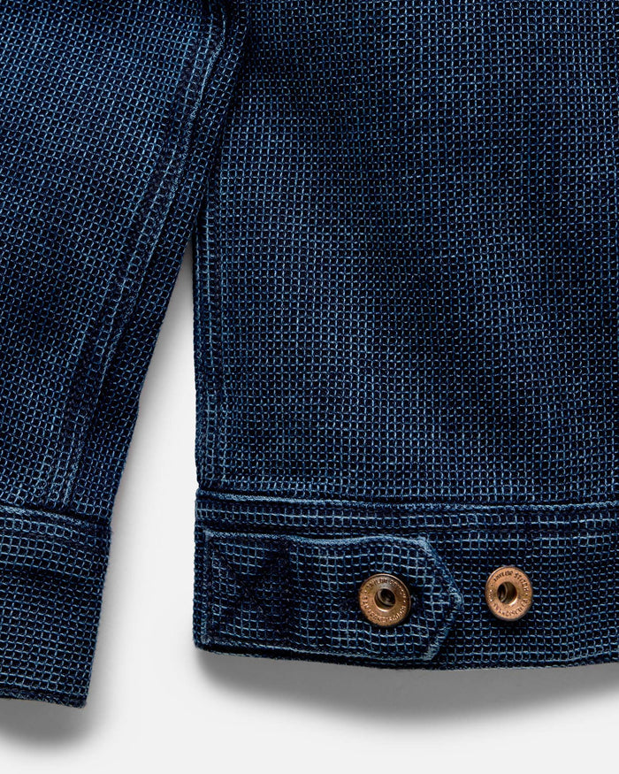 Close up of the sleeves on The Long Haul Jacket in Rinsed Indigo Waffle