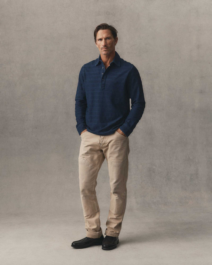 fit model showing off the back collar on The Long Sleeve Polo in Indigo Knit Stripe