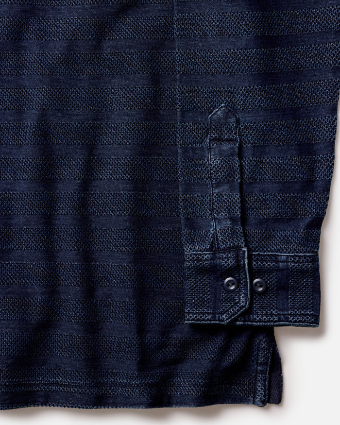 material shot of the cuff on The Long Sleeve Polo in Indigo Knit Stripe
