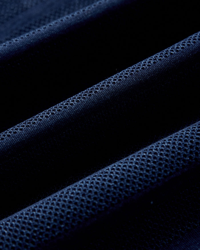 material shot of the fabric on The Long Sleeve Polo in Indigo Knit Stripe