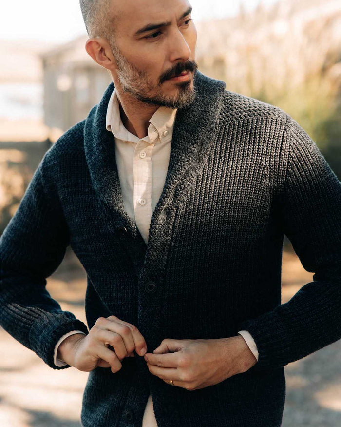 fit model buttoning up The Mariner Shawl Cardigan in Ink Slub