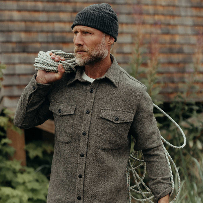 fit model holding a rope wearing The Maritime Shirt Jacket in Ash Twill