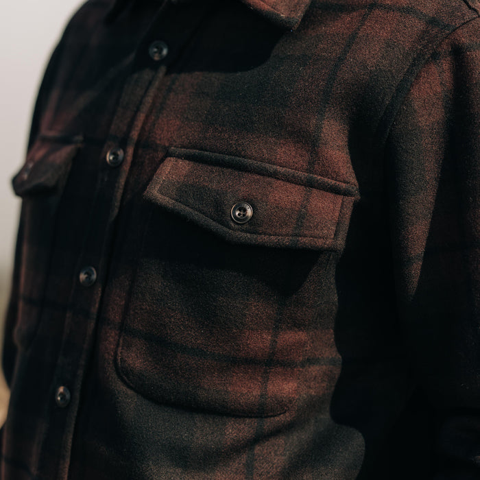 fit model posing in The Maritime Shirt Jacket in Carson Plaid