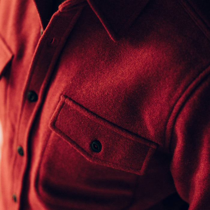 our fit model wearing The Maritime Shirt Jacket in Clifford Red—cropped shot of chest