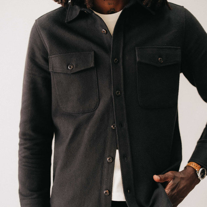fit model with his hand in his pocket wearing The Maritime Shirt Jacket in Faded Black Moleskin Twill