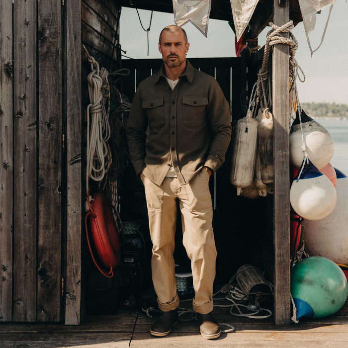 fit model posing in The Maritime Shirt Jacket in Fatigue Olive Moleskin Twill