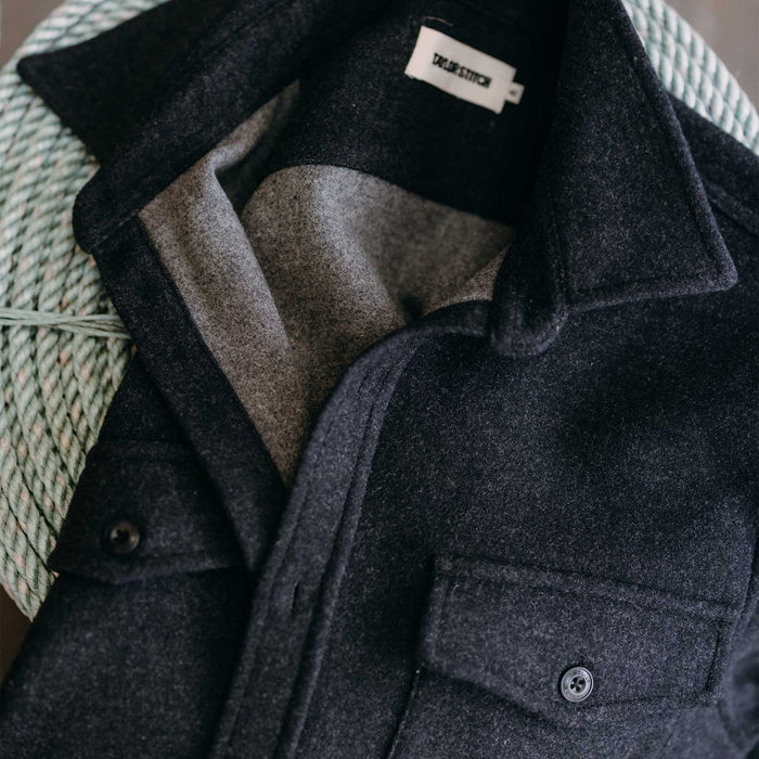 editorial flatlay of The Maritime Shirt Jacket in Heather Charcoal