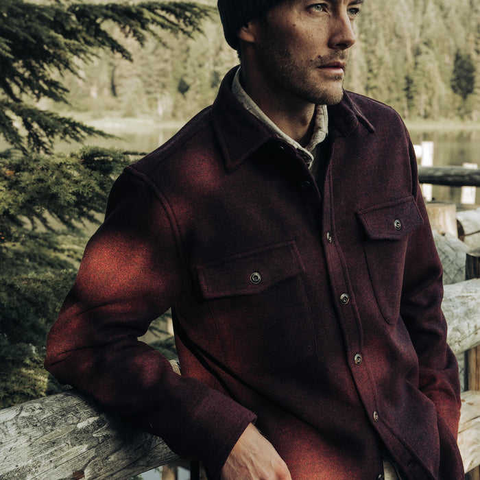 fit model leaning against a gate in The Maritime Shirt Jacket in Port Twill