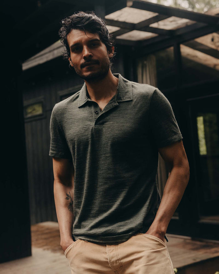 fit model posing in The Merino Polo in Heather Army