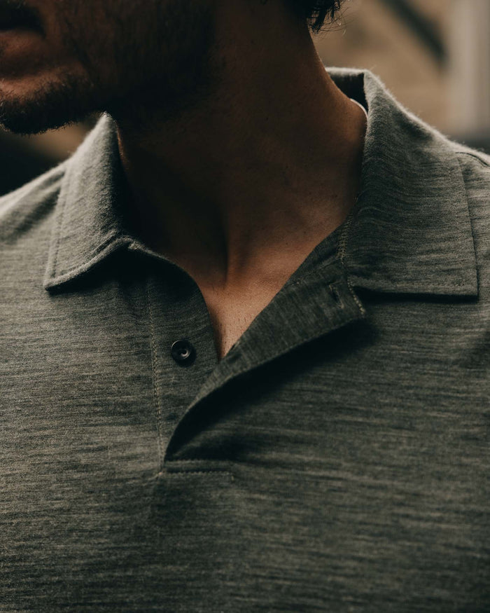 fit model showing off the collar on The Merino Polo in Heather Army