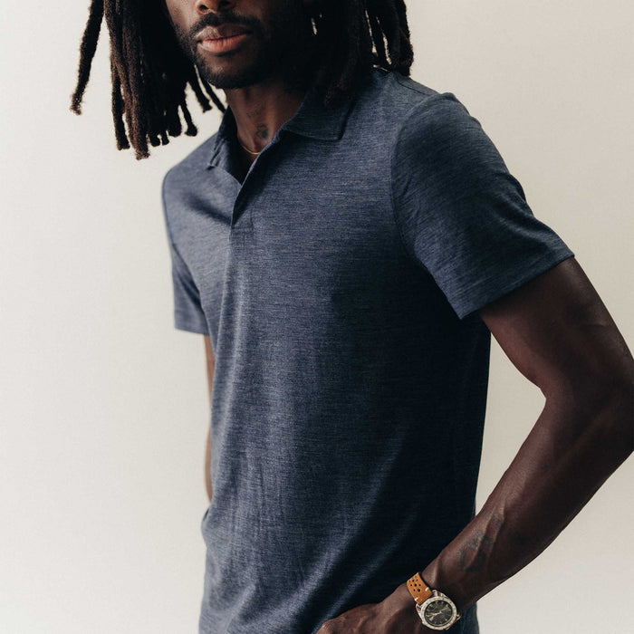 fit model posing in The Merino Polo in Heather Navy