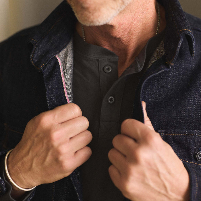 fit model showing off the selvage edge on The Mill Shirt Jacket in Kuroki Slub Denim